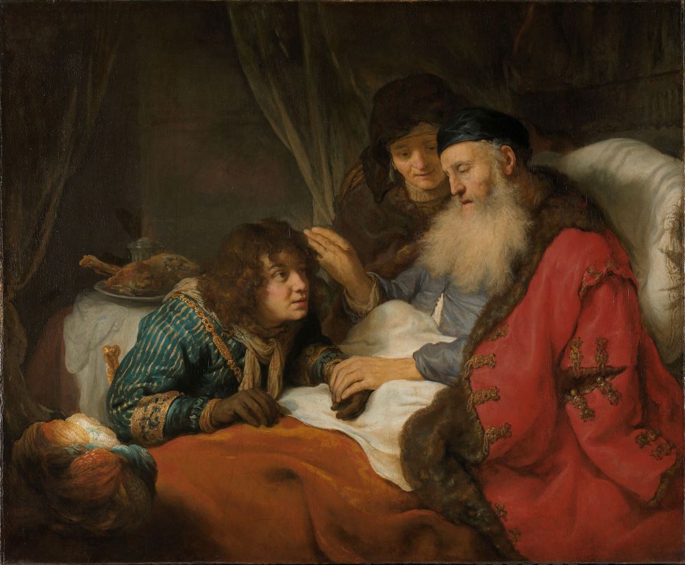 Na fotografii je obraz, na ktorom Izák už ako starý muž sedí v posteli. Nad ním sa skláňa jeho syn Jákob. Izák sa dotýka synovej ruky v rukavici zo zvieracej kožušiny. Celú scénu pozoruje Izákova žena.